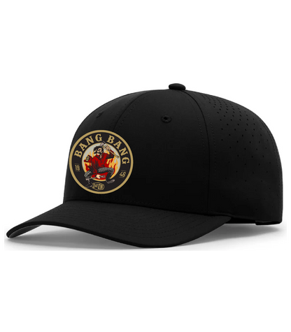 A black structured baseball cap with a curved brim, featuring a circular woven embroidered patch on the front that reads 'BANG BANG' with a  cartoon character holding fire fighter tools. The cap has perforated ventilation holes on the side panels and is photographed on a clean white background.